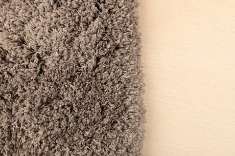 Gray chenille soft bath mat texture background. Bath Accessories. Top view. Stock Photos
