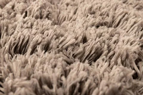 Gray chenille soft bath mat texture background. Bath Accessories. Top view. Stock Photos