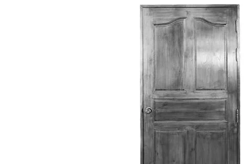 Gray closed door with frame isolated on background. Stock Photos
