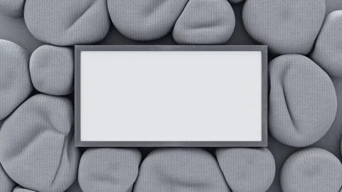 Gray cloth ball spheres squeezed together around gray text box on gray cloth. Stock Footage 265126329