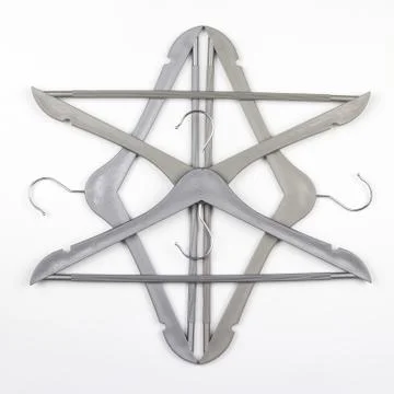 Gray clothes hanger on a white background. The choice of style of fashionable Stock Photos