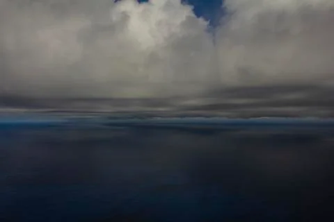 Gray cloud hunk formations on tropical sky, Nimbus moving. Stock Photos