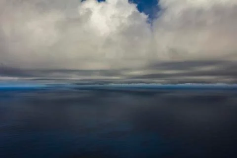Gray cloud hunk formations on tropical sky. Stock Photos