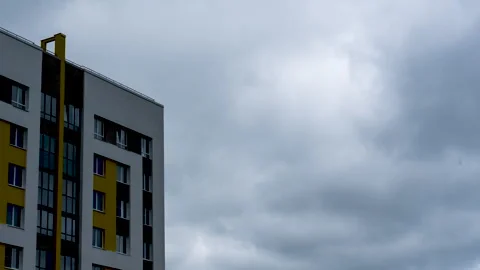 A gray cloud in the sky before a thunderstorm and the front of a building. Stock-Footage 278523041