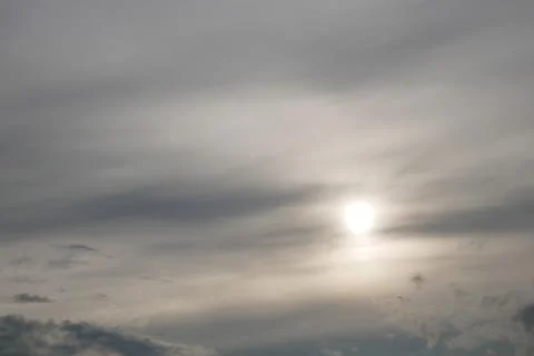 Gray clouds and the sun Stock Photos
