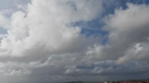 Gray clouds in a blue sky. Time Lapse. Stock Footage 256260964