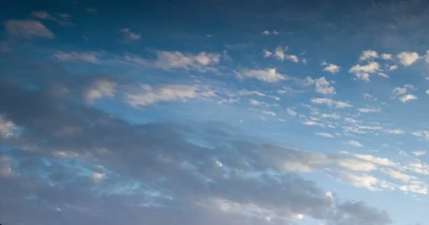 Gray clouds fly through the blue sky Stock Footage 79341706