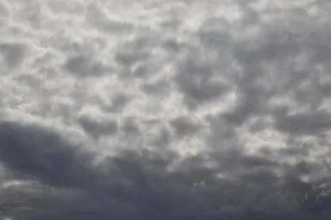 Gray clouds in the sky blurred background, blurry clouds in the gray sky, clo Stock Photos