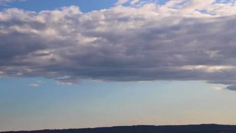 Gray clouds in the sky over the hills Stock Footage 141812397