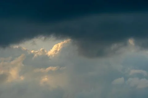 Gray clouds. The sky before the rain and thunder. Through the gray rain cloud Фото