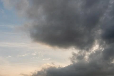 Gray clouds. The sky before the rain and thunder. Through the gray rain cloud Фото