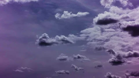 Gray clouds thicken against a blue sky with a pink tint. Time laps. Stock Footage 142081986
