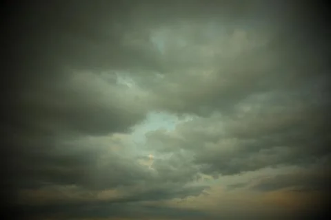 Gray cloudy sky as background. Dramatic sky. Stock Photos