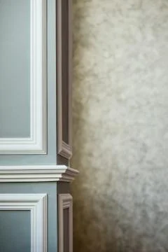 Gray column with white molding. Texturized grey putty. Vintage or grungy back Stock Photos