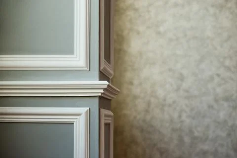 Gray column with white molding. Texturized grey putty. Vintage or grungy back Stock Photos