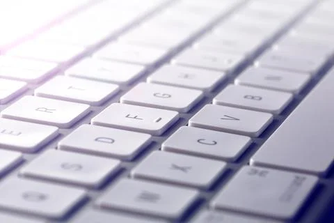 Gray computer keyboard seen in extreme close-up with the letters on the tuches Stock-Fotos