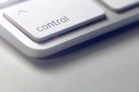 Gray computer keyboard seen in extreme close-up with control on the tuches Фото