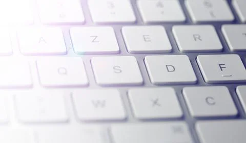 Gray computer keyboard seen in extreme close-up with the letters on the tuches Stock Photos