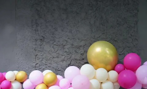 Gray concrete background in the form of a rough wall decorated with colorfu.. 스톡 사진