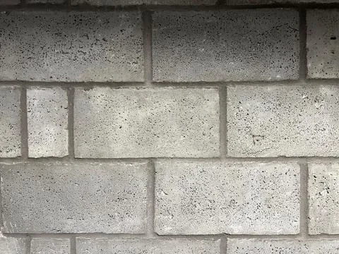 Gray Concrete Block Wall Texture Background With Copy Space and Pattern Foto stock