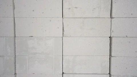 Gray concrete block wall texture with geometric grid pattern and subtle sur.. Stock Photos