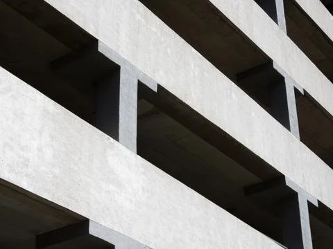 Gray concrete facade of a multi-level car park Stock Photos