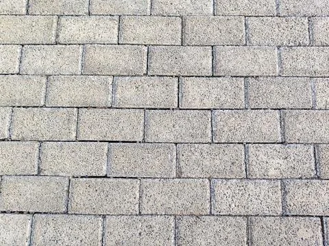 Gray concrete paving blocks texture background. Stock Photos