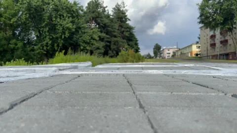 Gray concrete paving slabs stacked in rows wrapped in plastic film outdoors Vidéo 341510089