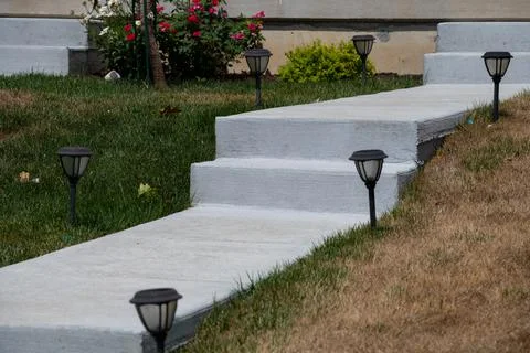 Gray concrete steps on the sidewalk Stock Photos