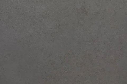 Gray concrete surface with subtle texture and patterns from different lighting Stock Photos