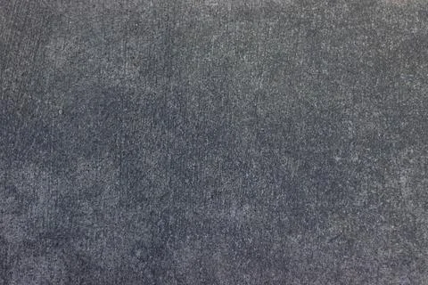 Gray concrete surface with uniform rough textured pattern Stock Photos