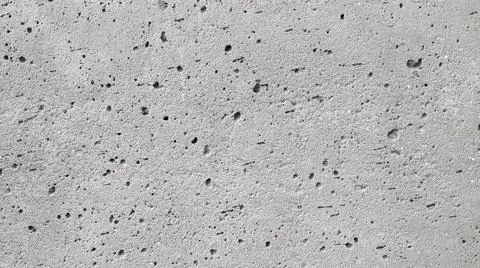 Gray concrete texture with air bubbles. Concrete background. Stock Photos