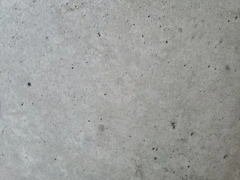 Gray concrete texture with subtle surface imperfections Stockfoto's