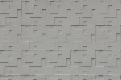 Gray concrete wall with geometric pattern background Stock Photos
