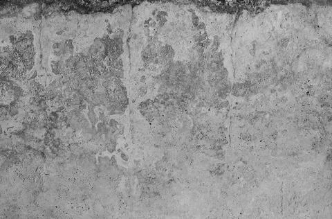 Gray concrete wall, old surface with peeling plaster. Building board texture. Stock Photos