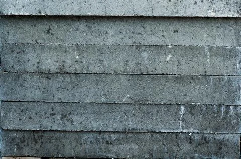 Gray concrete wall, old surface with peeling plaster. Building board texture Stock Photos