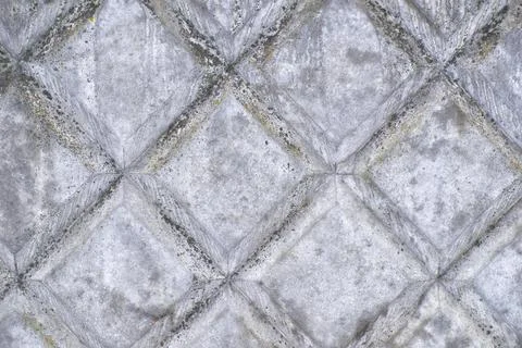 A gray concrete wall with a pattern of squares. background, texture Stock Photos