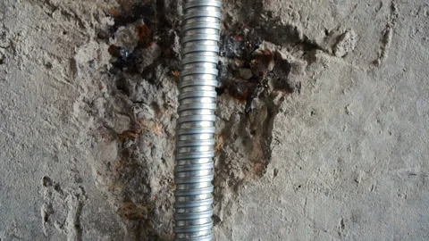 Gray corrugated metal cable channel to protect the wiring. Repair or Stock Footage 122226151