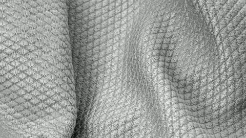 Gray cotton fabric with an interesting pattern Stock Footage 317269089