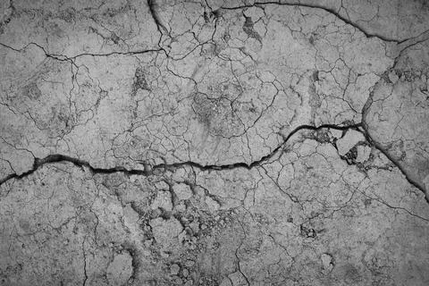 Gray cracked concrete texture background, close up Stock Photos