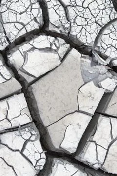 Gray cracked mud Stock Photos