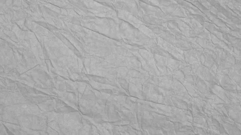 Gray crumpled paper background moves. Flat lay. Stop motion. Stock Footage 287561047