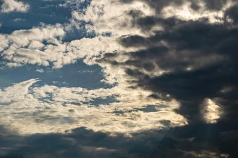 Gray Cumulus clouds in a blue sky Stock Photos