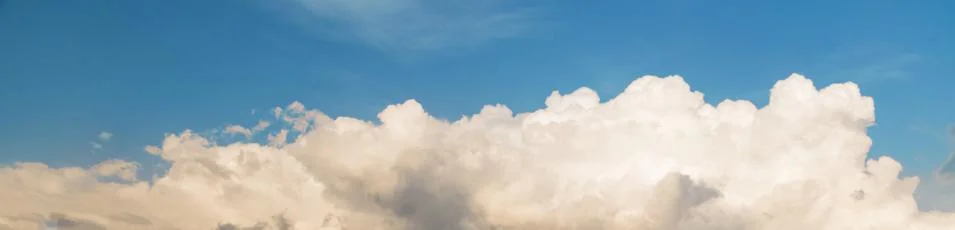 Gray Cumulus clouds in a blue sky Stock Photos