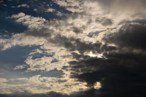 Gray Cumulus clouds in a blue sky Stock Photos