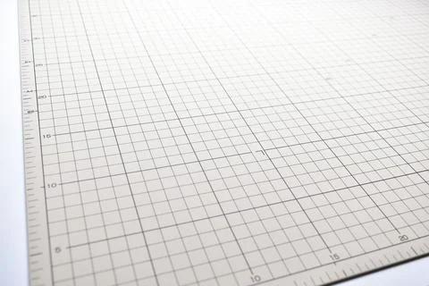 Gray cutting mat board background with line and scale measure guide pattern f Stock Photos