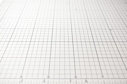 Gray cutting mat board background with line and scale measure guide pattern.. Stock Photos