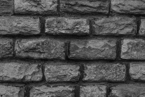Gray dark gradient background carved from the rock uneven weathered surface Stockfoto's