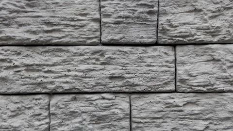 Gray decorative brick effect tiles on the facade of the house Stock Footage 249689493