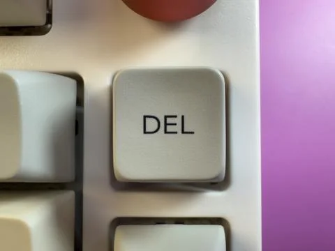 Gray delete key button of a computer keyboard. Macro photography. flay lay Stock Photos